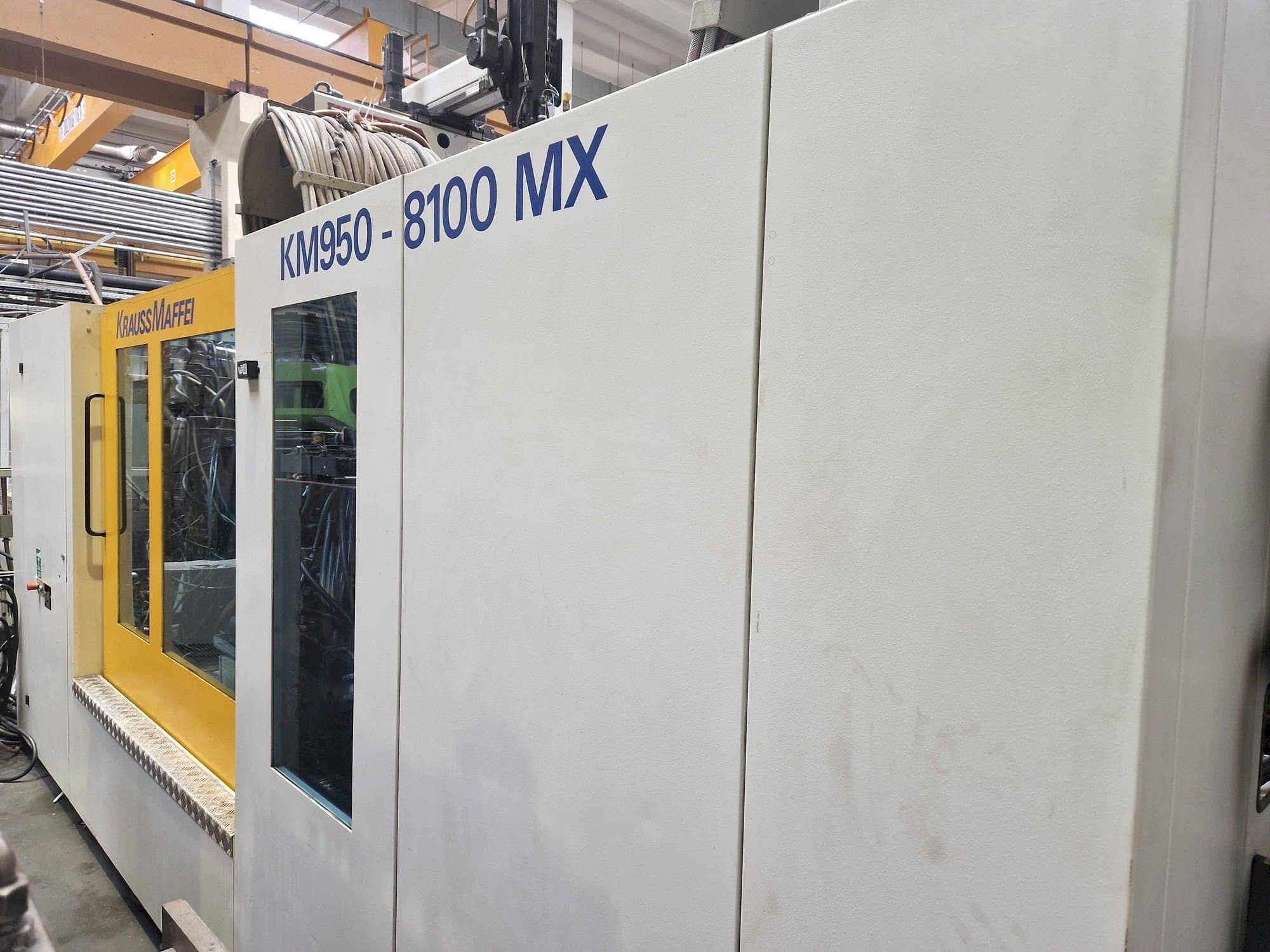 Masina Krauss Maffei 950-8100 MX eestvaade