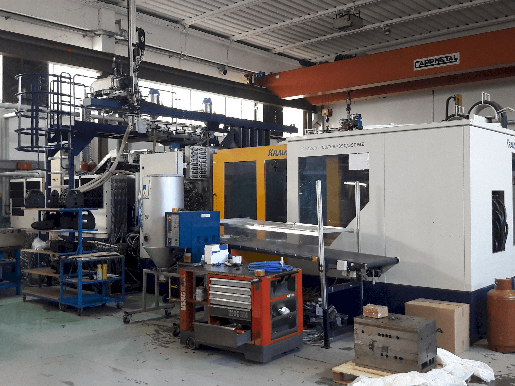 Masina Krauss Maffei 1300-700-700-390-390 MZ eestvaade
