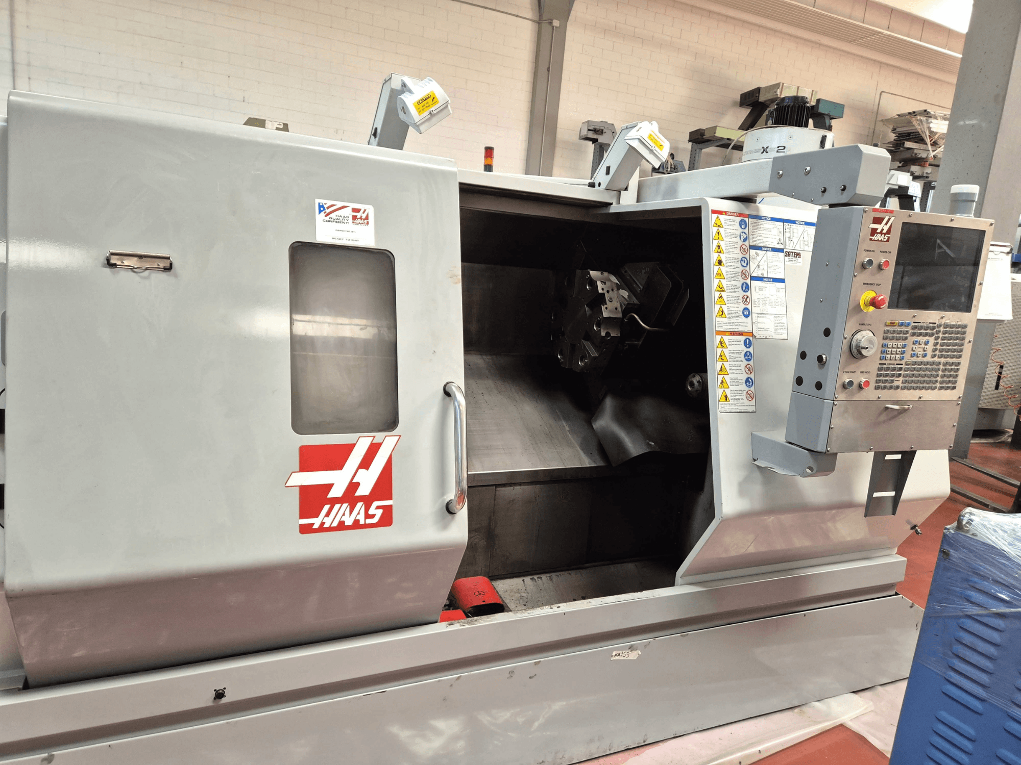 Haas SL 30TBHE horisontaalne treipink, esivaade, millel on näha juhtimispaneelid ja avatud töötlemiskamber.