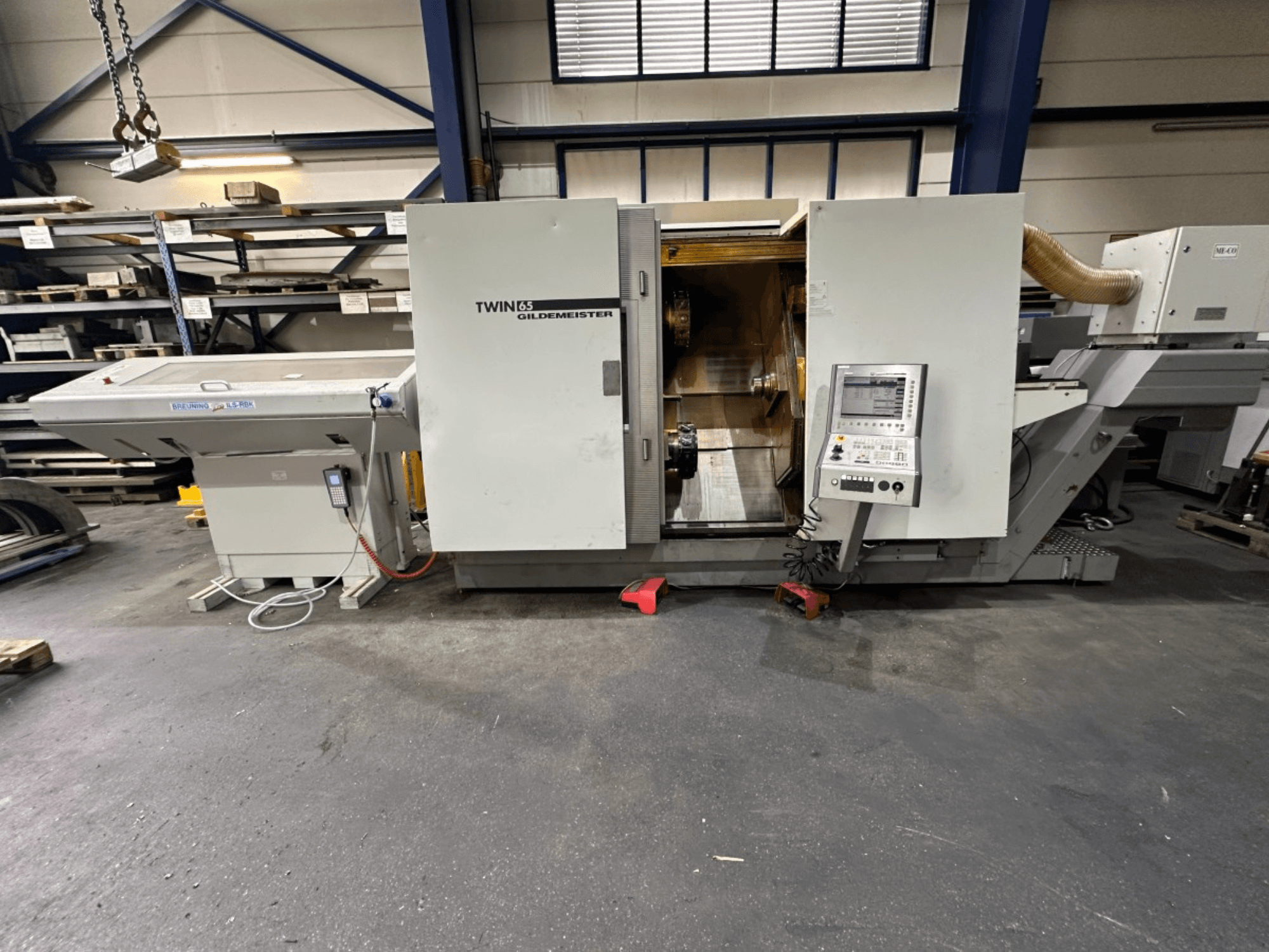 Gildemeister TWIN 65 horisontaalne treipink, esivaade; juhtpaneel ja nähtav sisemus detailide töötlemiseks.