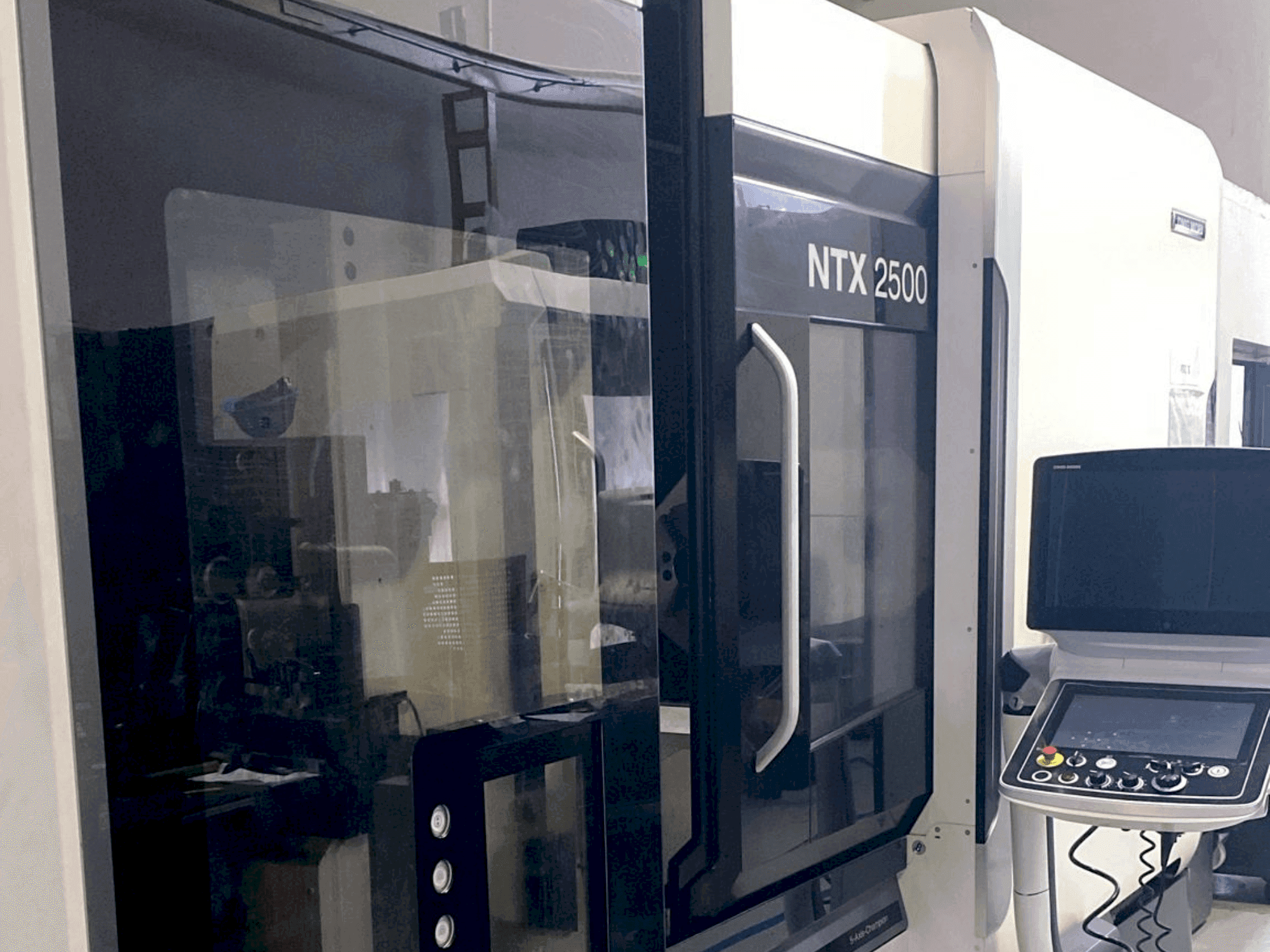 Masina DMG MORI NTX2500 / 1500 eestvaade