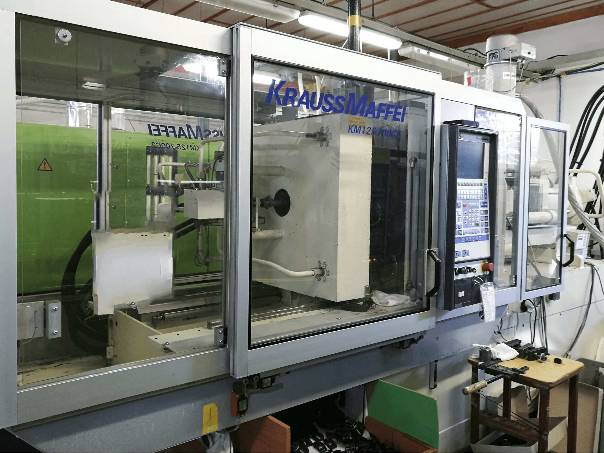 Masinavaade Krauss Maffei 125-700 C2 vasakult