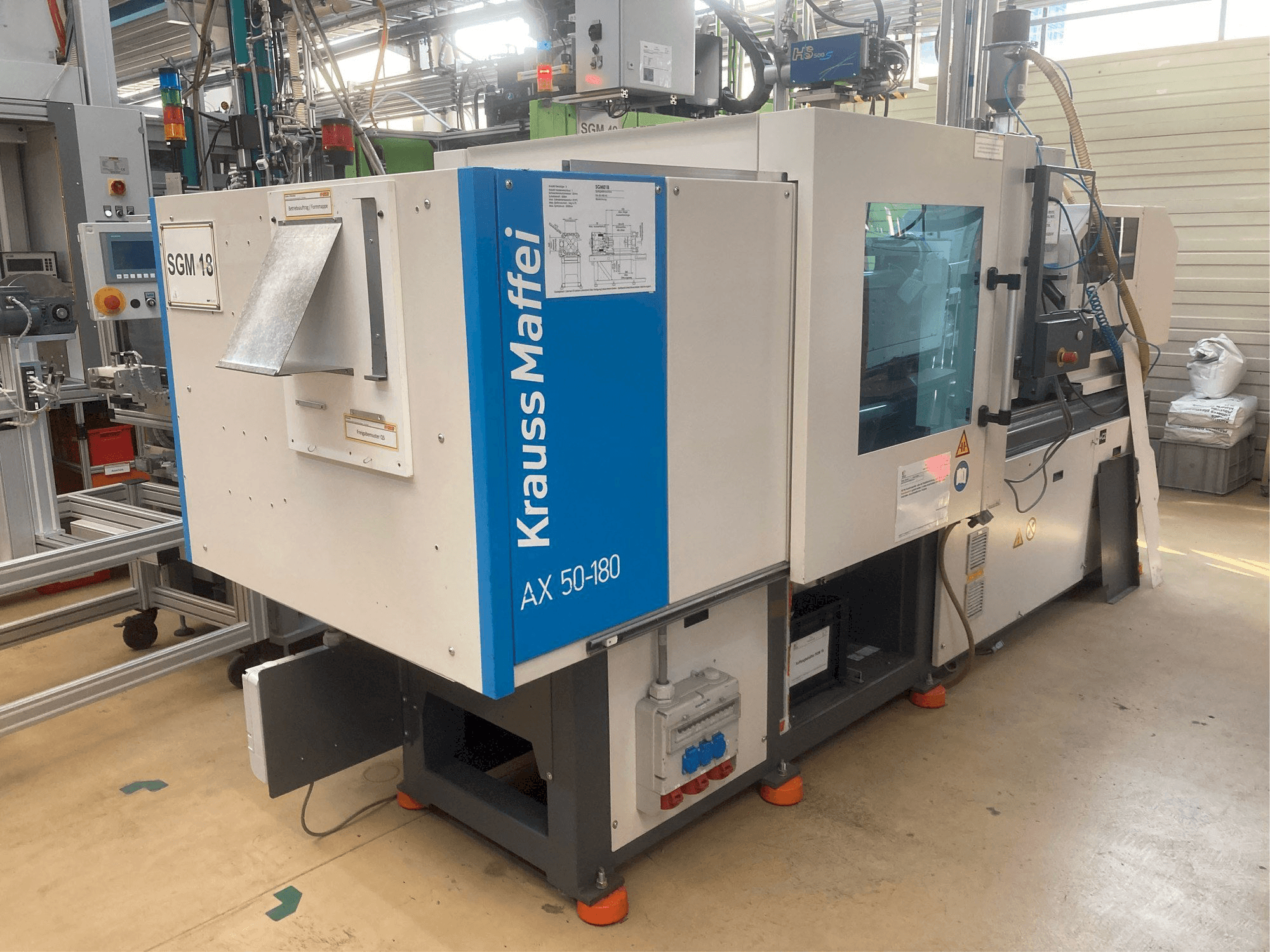 Masina Krauss Maffei AX 50-180 vasaku külje vaade