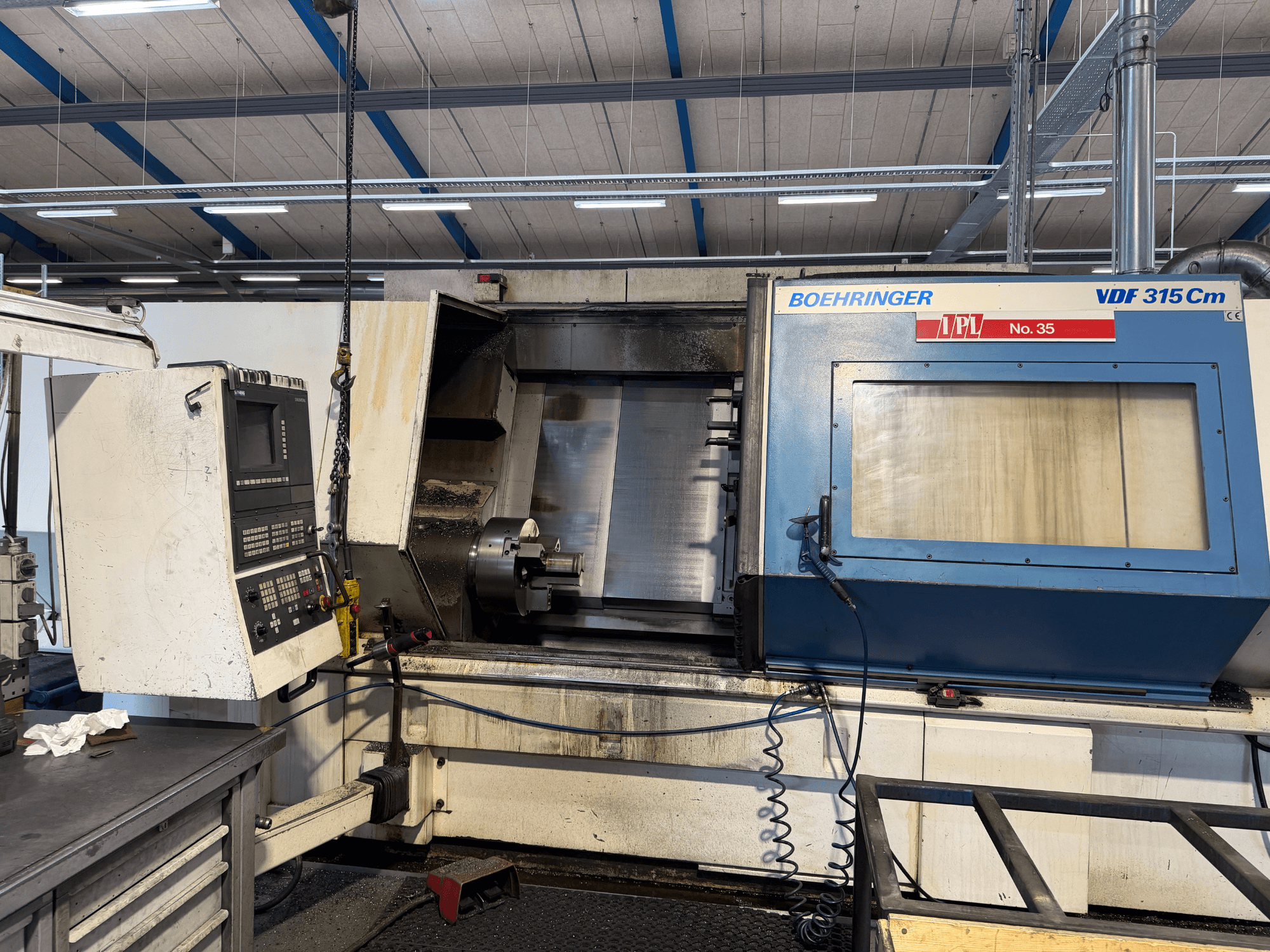 BOEHRINGER VDF 315 CM horisontaalse treipingi esivaade, millel on juhtpaneel ja avatud töötlemisala.