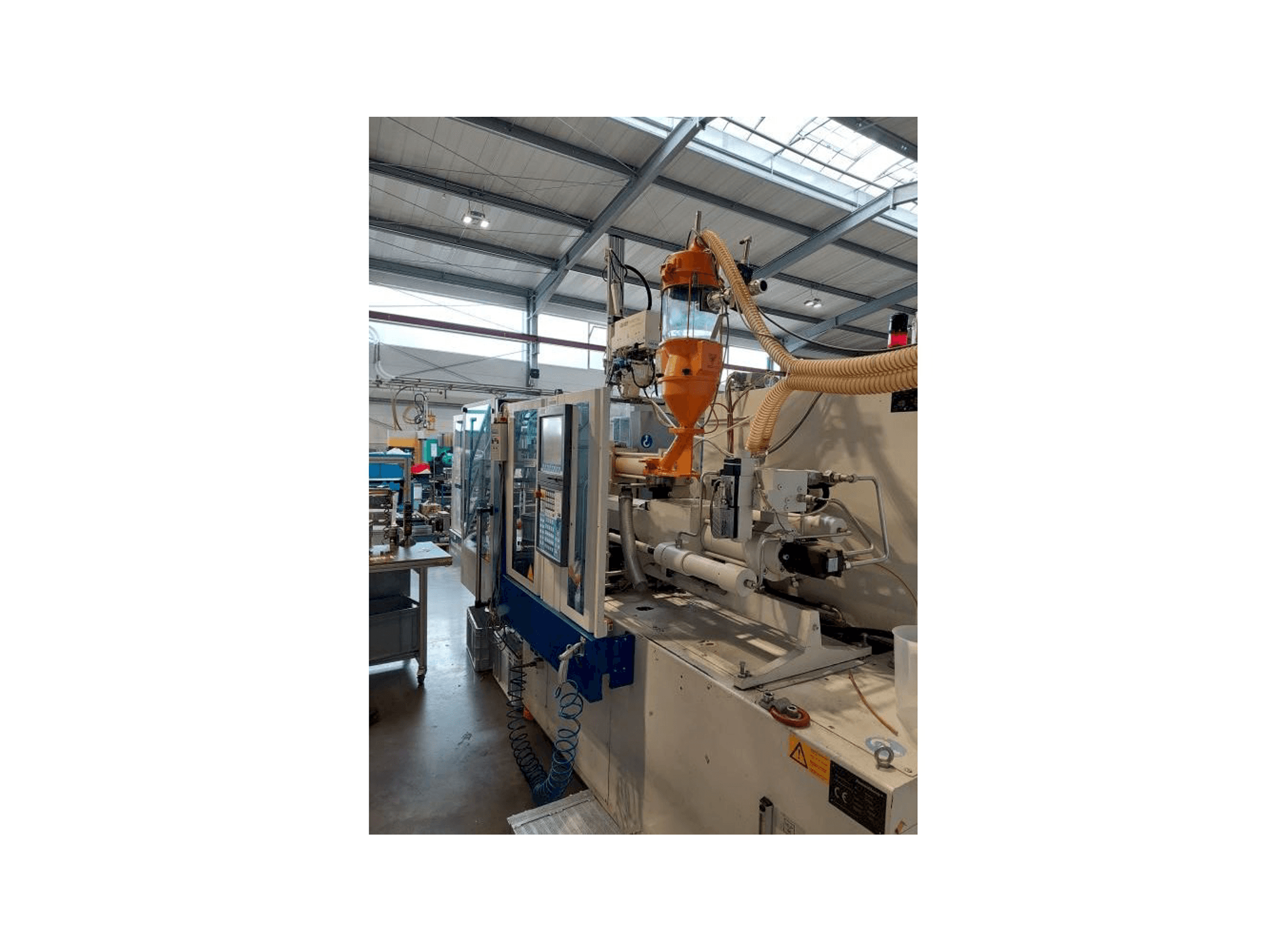 Masina Krauss Maffei 80-180 CX eestvaade