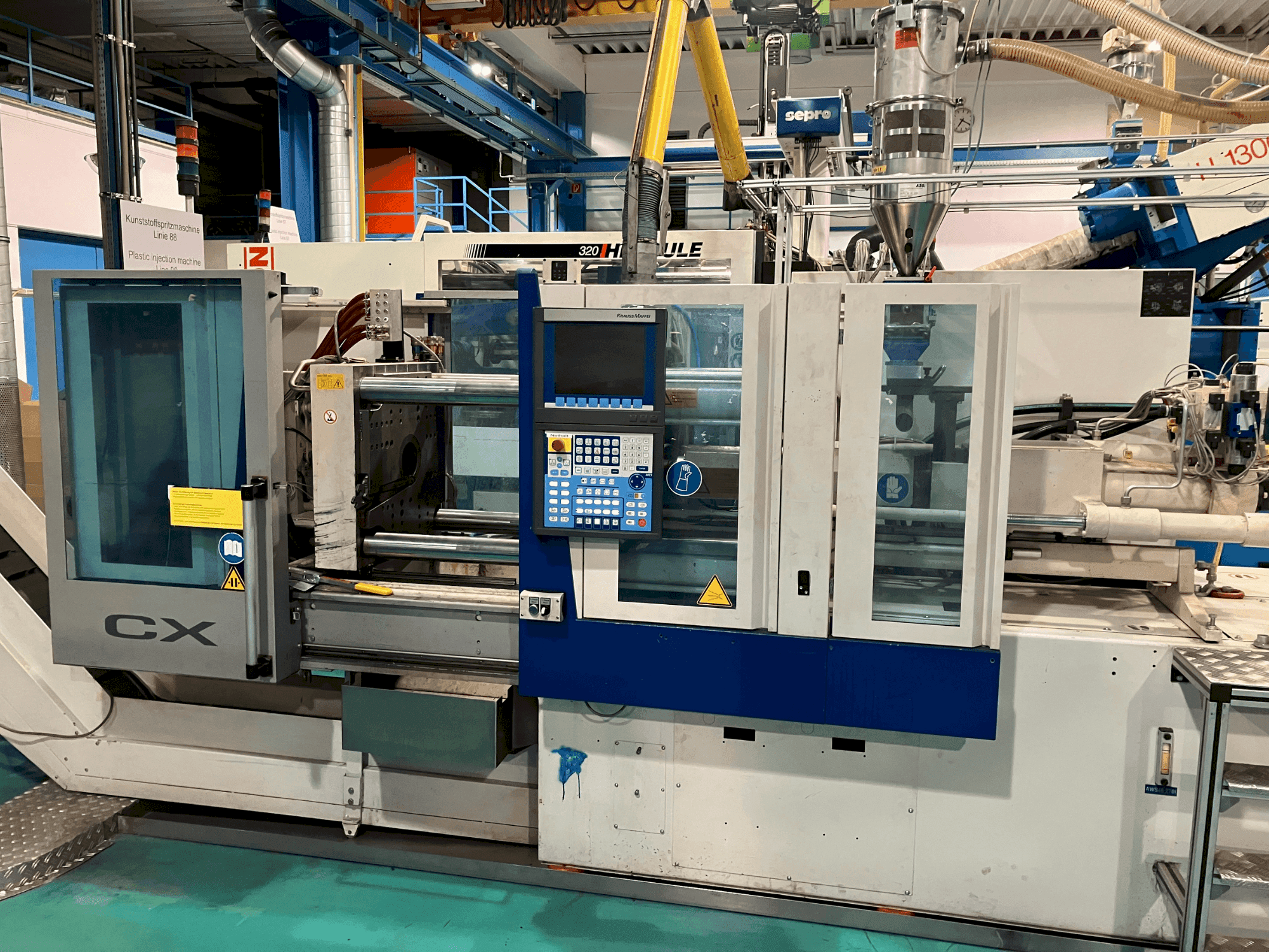 Masina Krauss Maffei 65-180 CX eestvaade