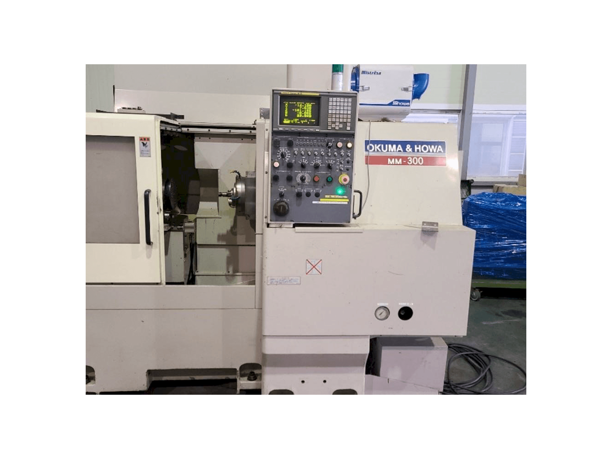 Masina OKUMA&HOWA MM-300 eestvaade