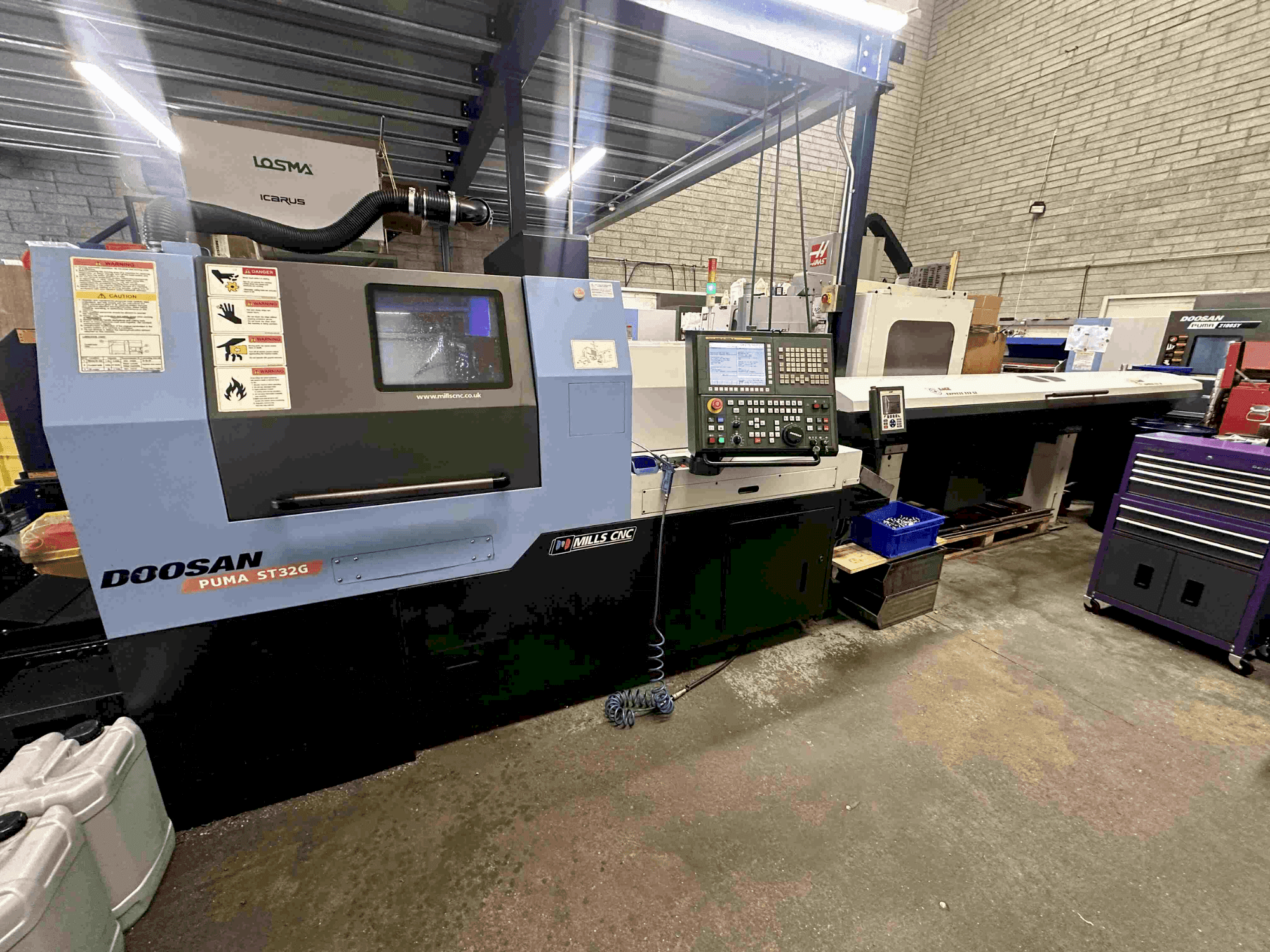 Masina DOOSAN Puma ST32G eestvaade