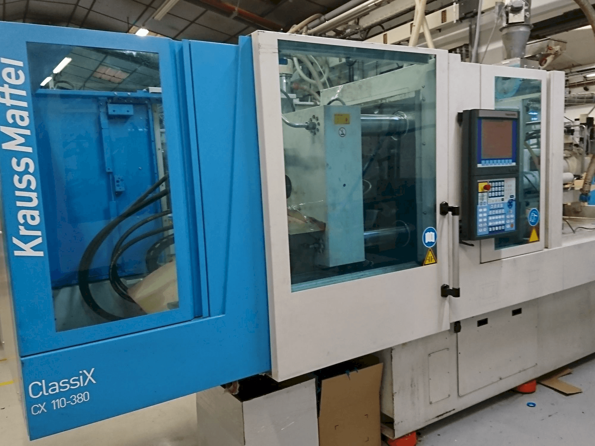 Masina Krauss Maffei 110-380 CX eestvaade