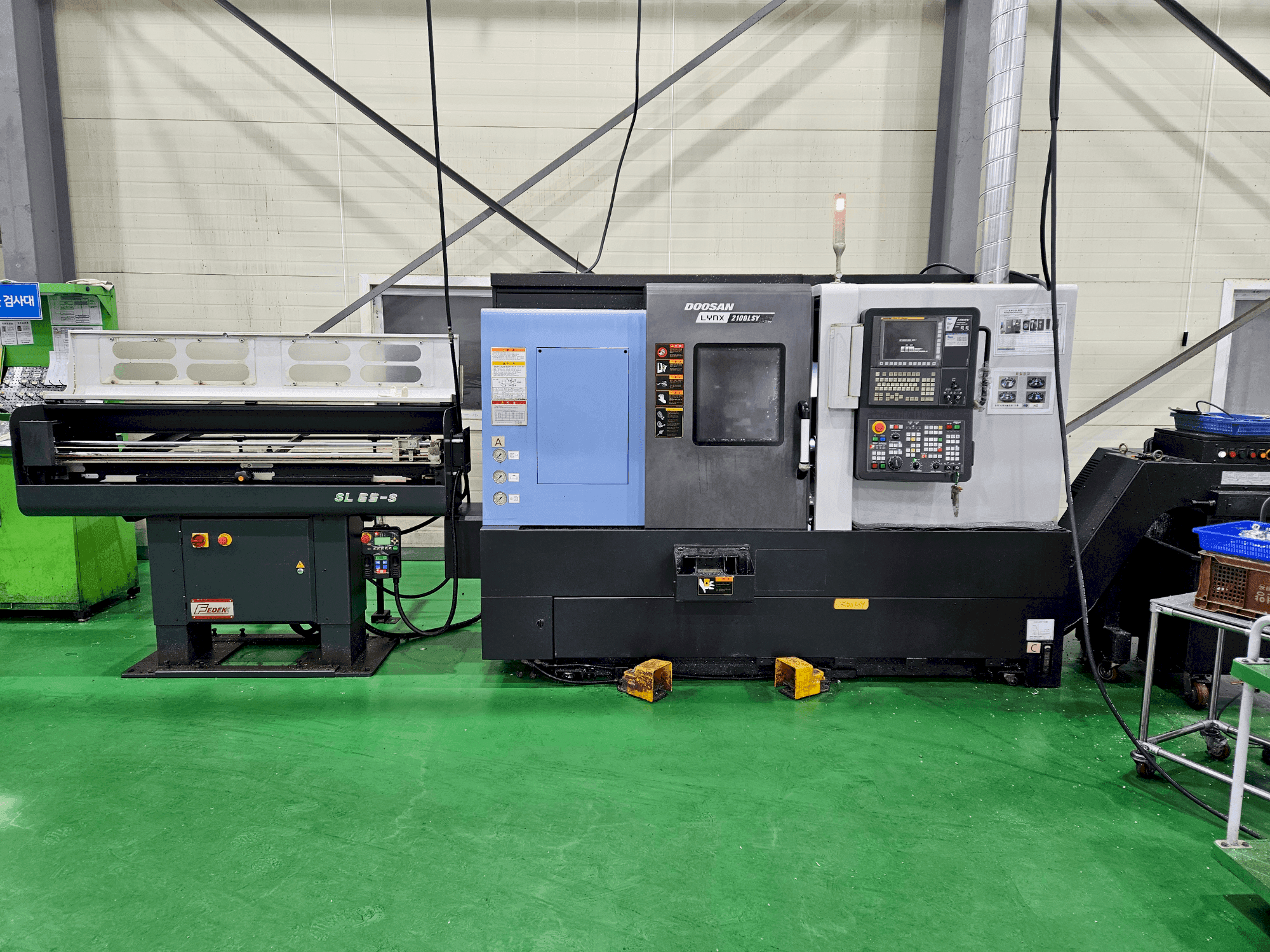 Masina DOOSAN LYNX 2100 LSYB eestvaade