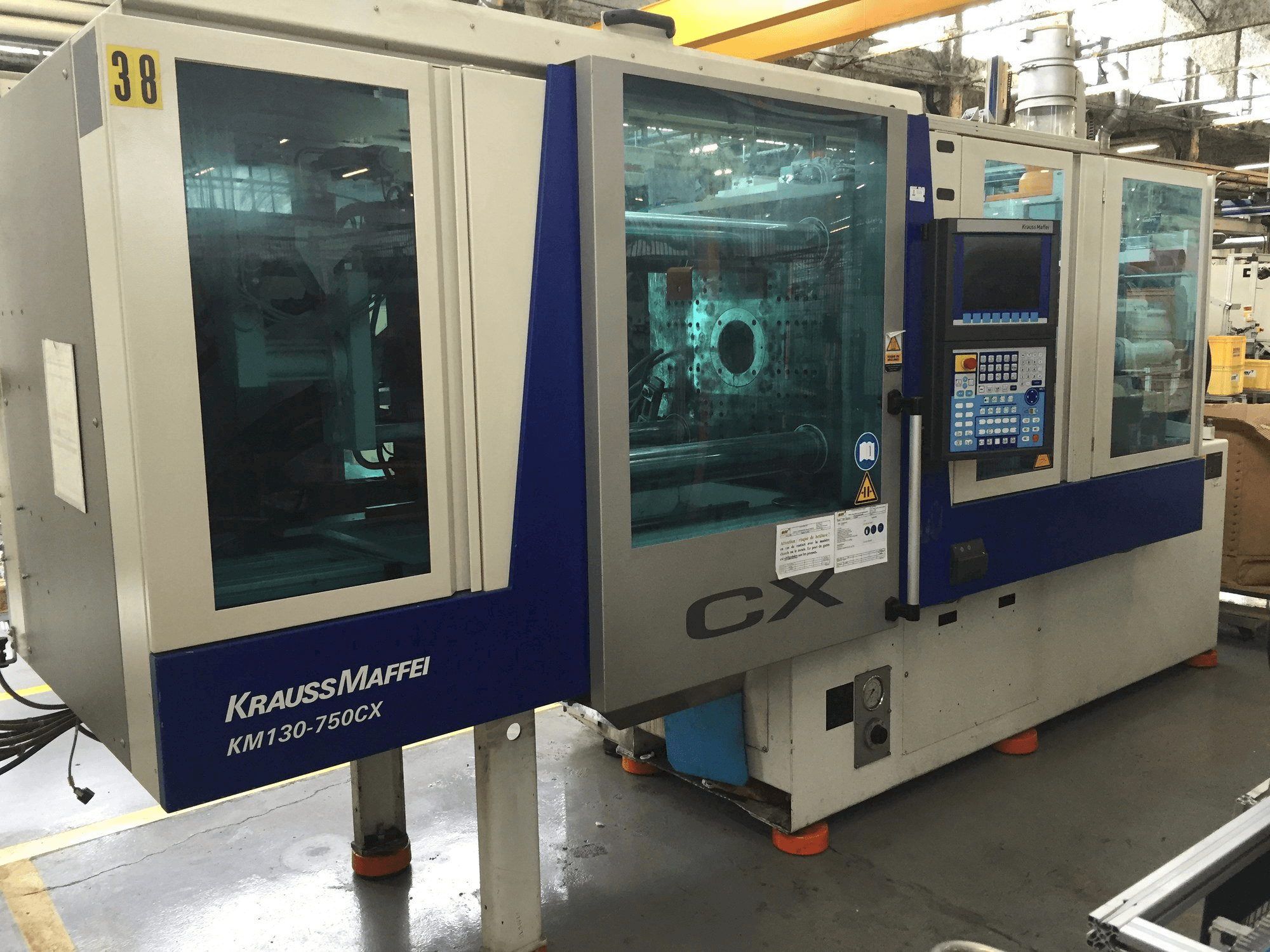 Masina Krauss Maffei 130-750 CX eestvaade