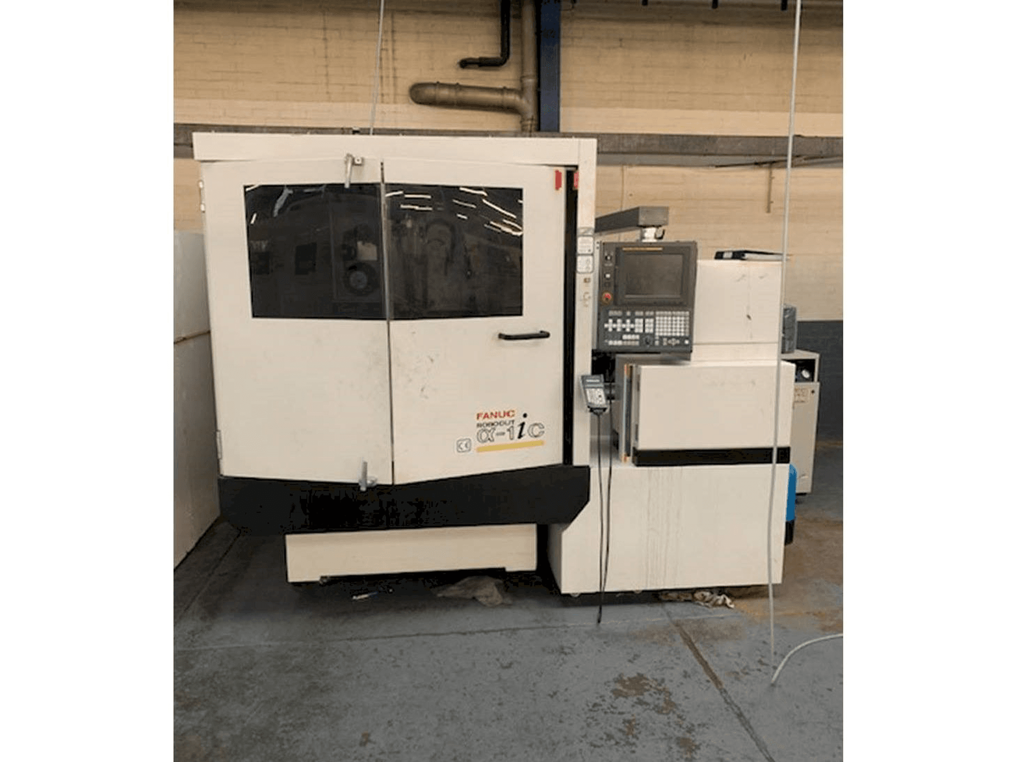 Masina FANUC ROBOCUT Alpha -1iC S Axis eestvaade