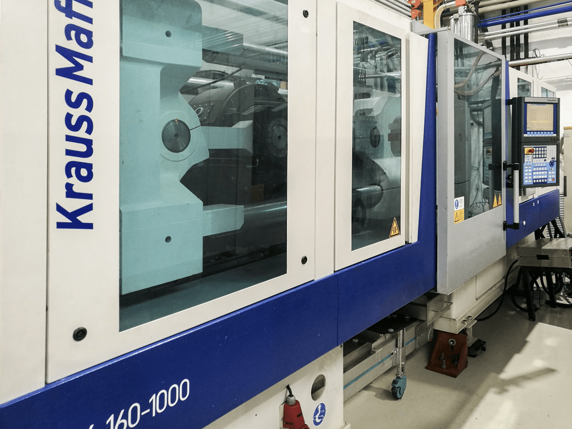 Masinavaade Krauss Maffei 160-1000 EX vasakult