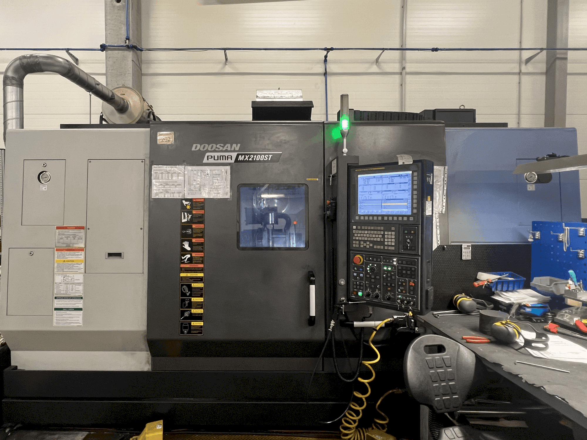 Masina DOOSAN MX2100ST eestvaade